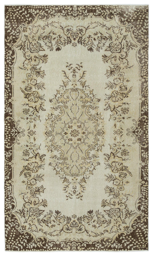 Load image 1 in gallery view. Beige and brown vintage-style rug with a central floral medallion and a decorative border on a white background.