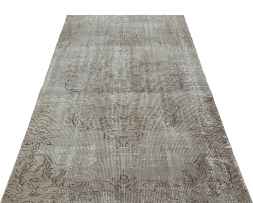 Load image 1 in gallery view. Taupe and grey distressed vintage-style rug with a faded traditional medallion pattern on a white background.
