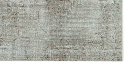Load image 1 in gallery view. Taupe and grey rug with a faded, distressed traditional floral medallion pattern.