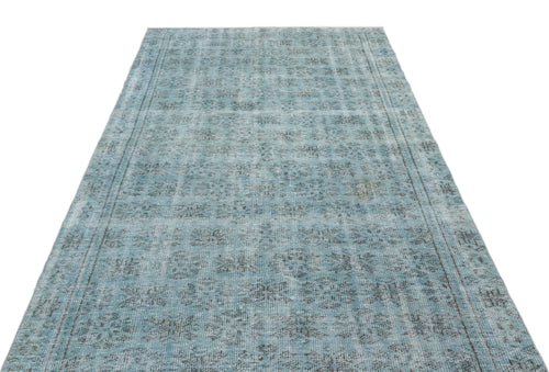 Load image 1 in gallery view. Light blue distressed rug with a faded traditional floral pattern and a dark border on a white background.