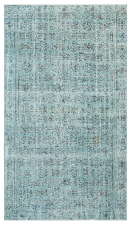 Load image 1 in gallery view. Light blue and grey distressed rug with a repeating floral medallion pattern and a thin border.