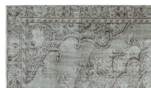 Load image 1 in gallery view. Grey and brown distressed rug with a traditional ornate floral border and medallion pattern.