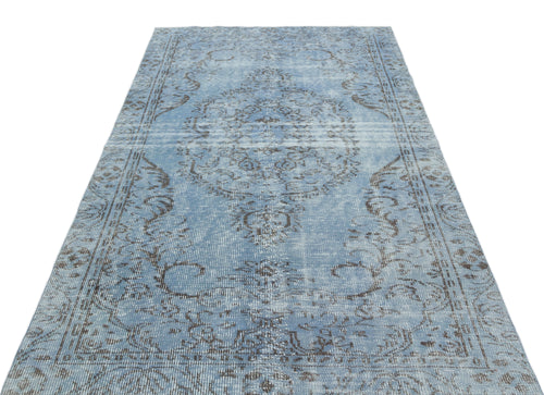 Load image 1 in gallery view. Light blue and charcoal distressed rug with a traditional central medallion and ornate border pattern.