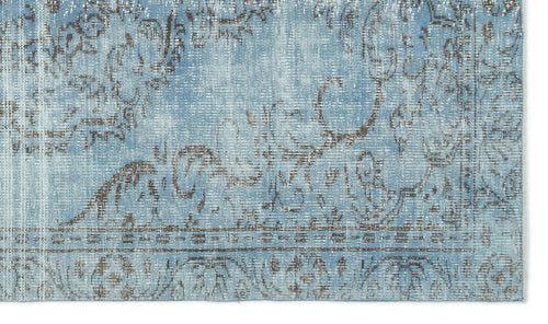 Load image 1 in gallery view. Light blue and grey distressed rug with a faded traditional floral medallion pattern.