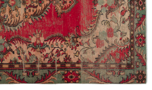 Load image 1 in gallery view. Distressed red, sage green, and beige traditional rug with an intricate floral medallion pattern and a decorative border.