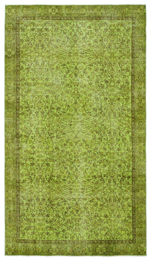 Load image 1 in gallery view. Chartreuse and olive green traditional rug with a distressed floral medallion pattern and a decorative border.
