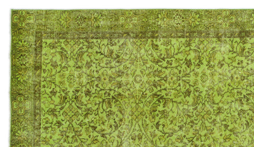 Load image 1 in gallery view. Chartreuse and olive green vintage-style rug with a traditional floral medallion pattern and a detailed border.