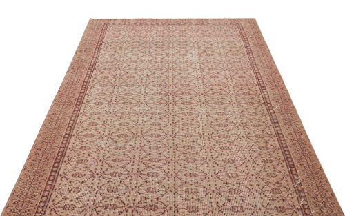 Load image 1 in gallery view. Terracotta and beige vintage-style rug with a repeating geometric diamond pattern and a decorative border.