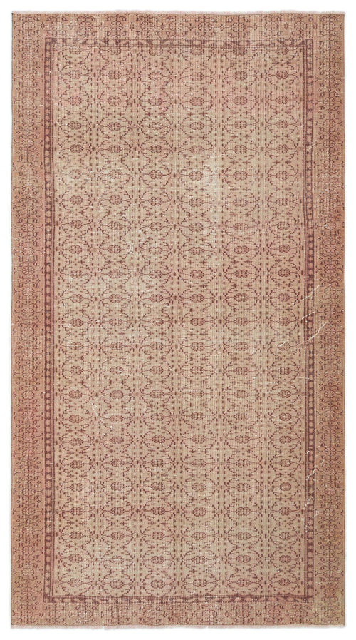 Load image 1 in gallery view. Dusty rose vintage-style rug with a repeating geometric lattice pattern and a decorative border.