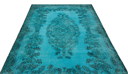 Load image 1 in gallery view. Turquoise and dark teal distressed rug with a traditional central medallion and floral border on a white background.