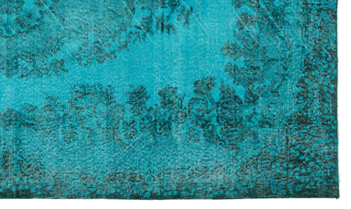 Load image 1 in gallery view. Bright turquoise rug with a distressed black floral medallion pattern and a dark border.