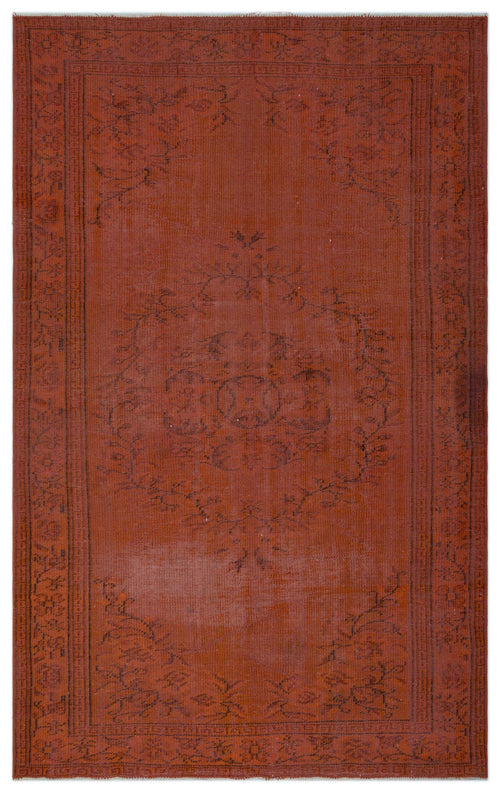 Load image 1 in gallery view. Rust-colored vintage rug with a dark, faded central floral medallion and a decorative border.