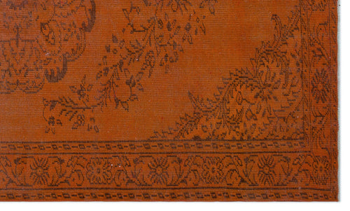 Load image 1 in gallery view. Burnt orange rug with a dark brown floral medallion pattern and a geometric border.