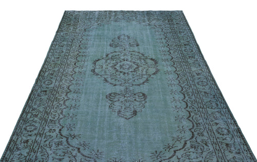 Load image 1 in gallery view. Distressed teal and charcoal rug with a central medallion and ornate border pattern on a white background.