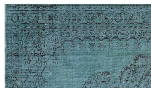 Load image 1 in gallery view. Teal and dark grey rug with a distressed traditional floral medallion border and intricate vine patterns.
