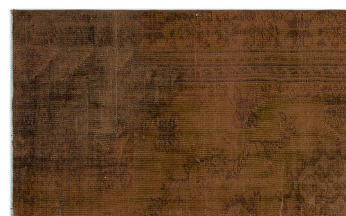 Load image 1 in gallery view. Dark brown distressed rug with a faint, tonal traditional medallion pattern.