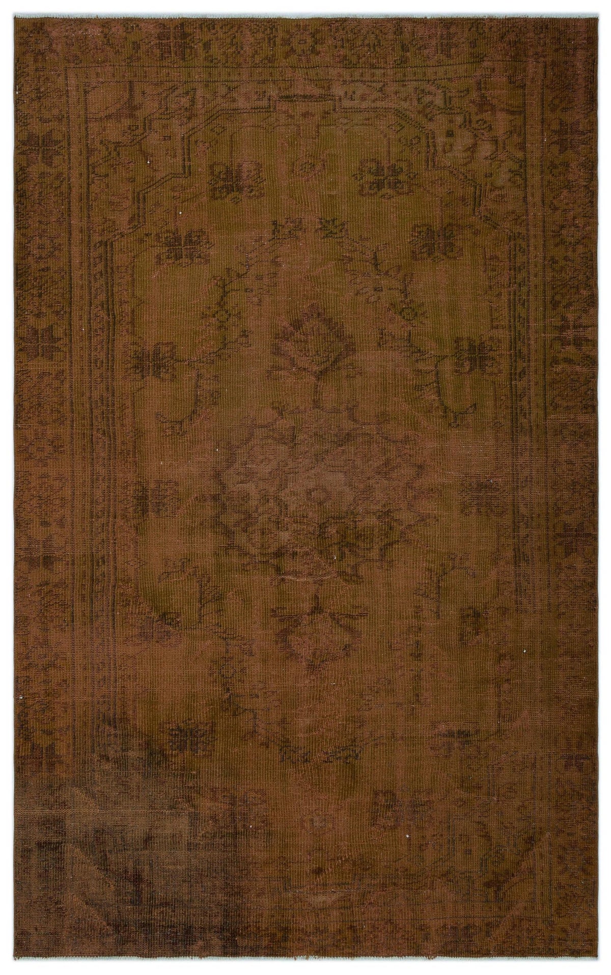 Monochromatic brown vintage-style rug with a faded central floral medallion and ornate border on a white background.