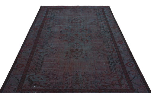 Load image 1 in gallery view. Dark charcoal and deep red distressed traditional rug with a central medallion and geometric border pattern.