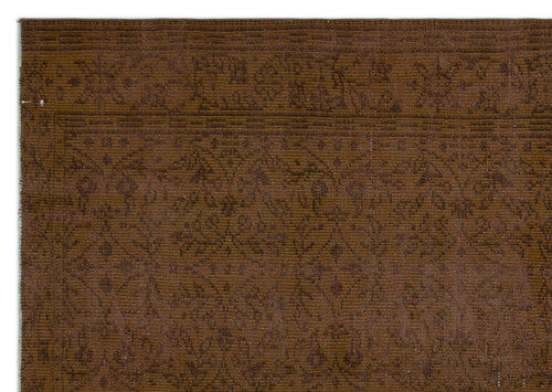 Load image 1 in gallery view. Dark brown rug with a tonal, low-contrast floral medallion pattern and a linear border.
