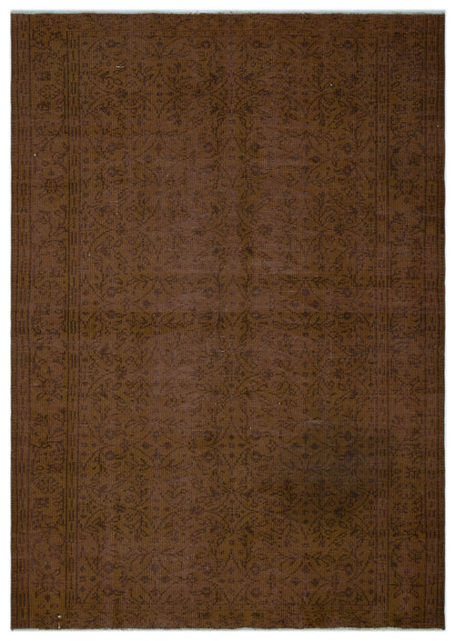 Load image 1 in gallery view. Dark brown monochromatic rug with a subtle, distressed floral medallion pattern and a linear border.