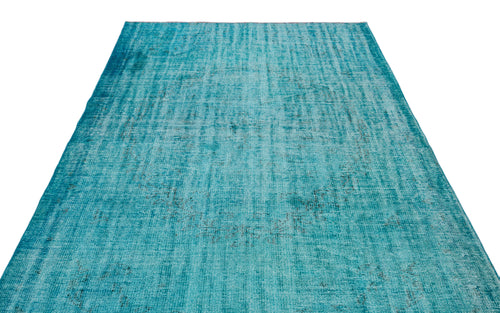 Load image 1 in gallery view. Teal distressed vintage-style rug with a faded, overdyed pattern on a white background.
