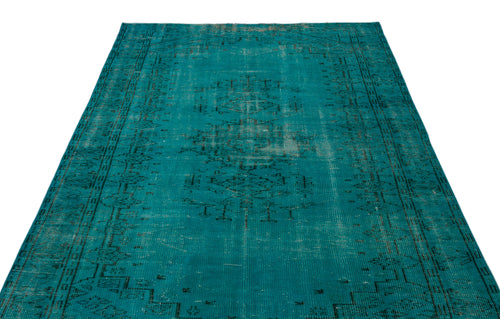 Load image 1 in gallery view. Teal vintage-style rug with a distressed black central medallion and geometric border on a white background.