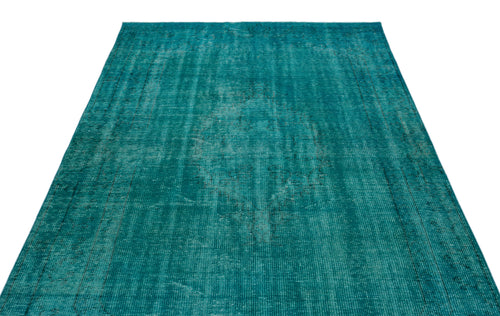 Load image 1 in gallery view. Teal distressed area rug with a faded central medallion and border pattern on a white background.