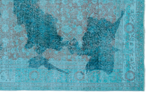 Load image 1 in gallery view. Turquoise and dark blue distressed rug with a faded traditional medallion pattern.