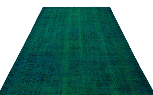 Load image 1 in gallery view. Emerald green vintage-style rug with a faint, distressed traditional medallion pattern on a white background.