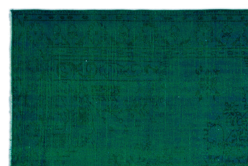 Load image 1 in gallery view. Deep emerald green rug with a subtle, distressed traditional medallion pattern.