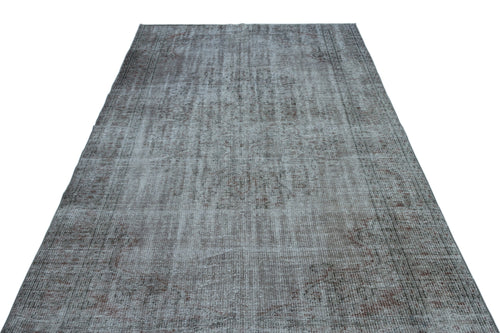 Load image 1 in gallery view. Grey and brown distressed vintage-style rug with a faded traditional medallion pattern on a white background.
