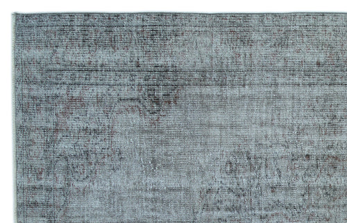 Load image 1 in gallery view. Blue-grey distressed rug with a faded, traditional medallion pattern and dark charcoal accents.