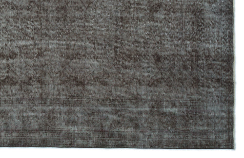 Load image 1 in gallery view. Dark brown distressed rug with a fine horizontal linear texture and subtle worn-in detailing.