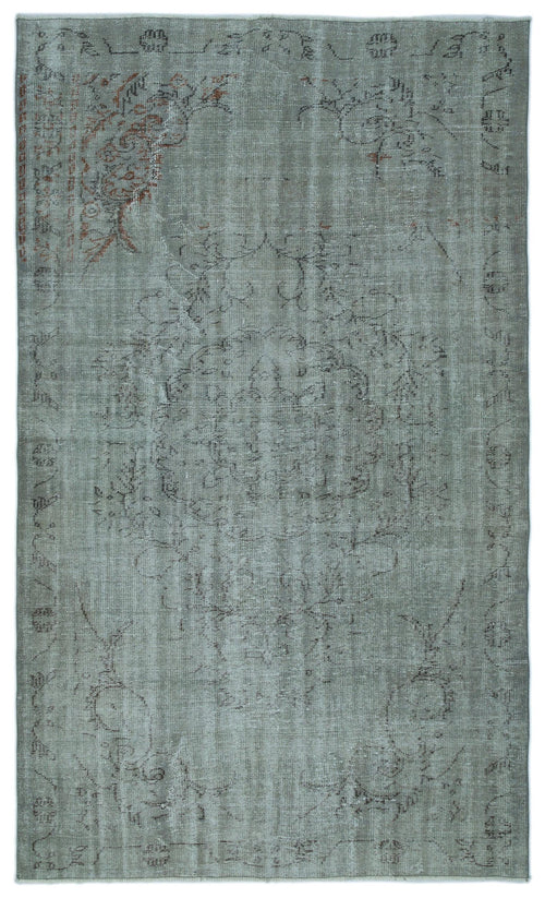 Load image 1 in gallery view. Sage green distressed vintage-style rug with a faded central medallion and subtle rust-colored floral accents.