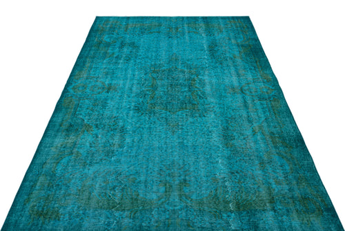Load image 1 in gallery view. Teal and dark green distressed rug with a faded traditional medallion pattern on a white background.