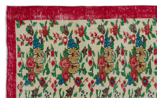 Load image 1 in gallery view. Cream rug with a distressed red border and a repeating floral pattern in red, green, blue, and yellow.