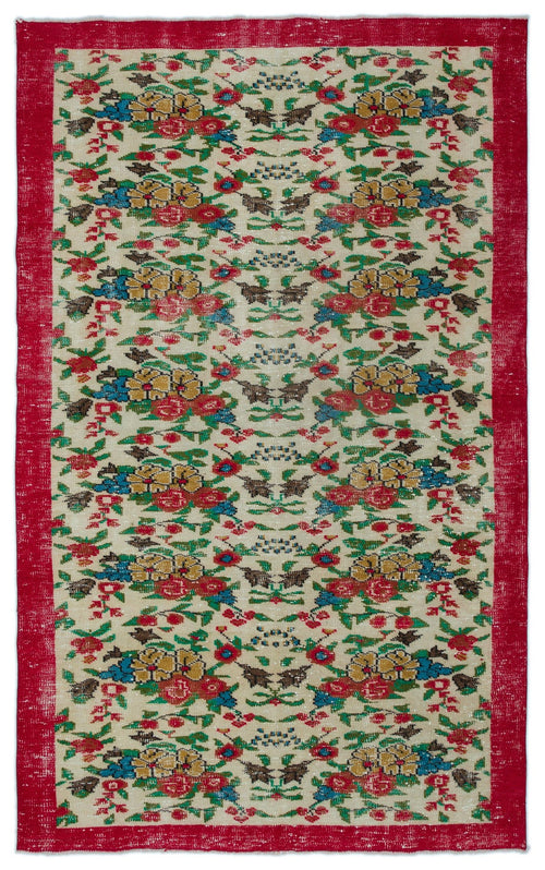 Load image 1 in gallery view. Cream rug with a red border and a repeating floral pattern in red, yellow, blue, and green on a white background.