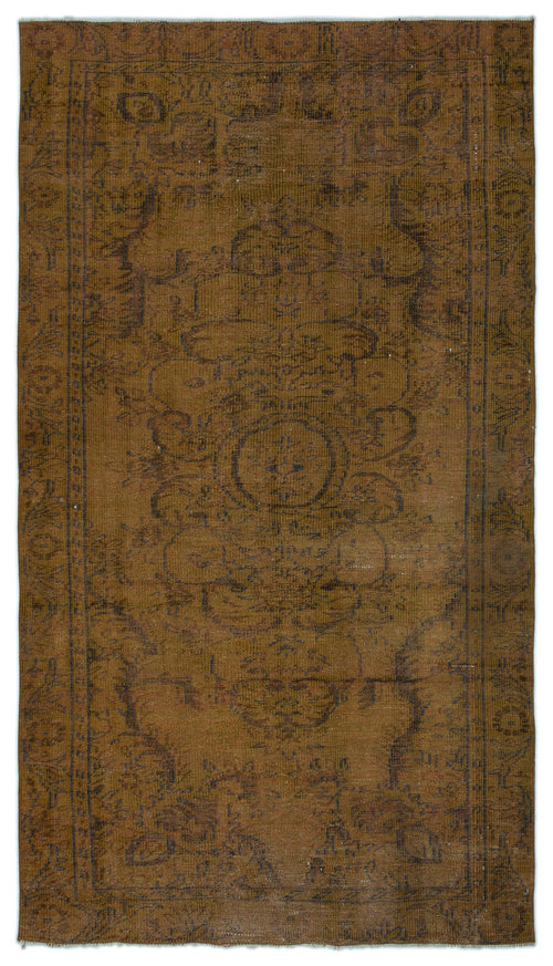 Load image 1 in gallery view. Monochromatic brown vintage-style rug with a faded central medallion and intricate border pattern.
