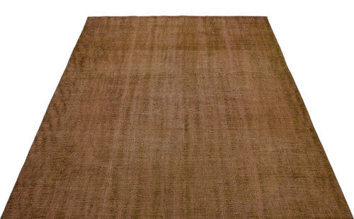 Load image 1 in gallery view. Solid brown vintage-style rug with a distressed, low-pile texture on a white background.