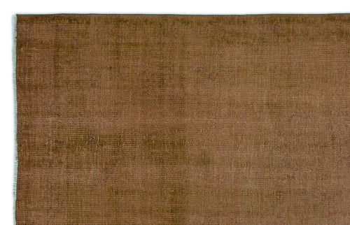 Load image 1 in gallery view. Solid brown rug with a distressed, weathered texture and visible woven fiber detail.