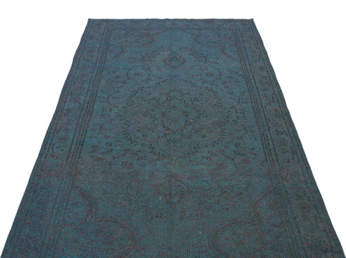 Load image 1 in gallery view. Dark teal distressed rug with a faint, traditional central medallion and border pattern on a white background.