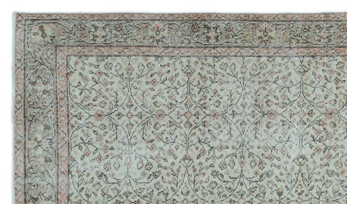 Load image 1 in gallery view. Sage green and dusty rose traditional rug with a distressed floral vine pattern and a decorative border.