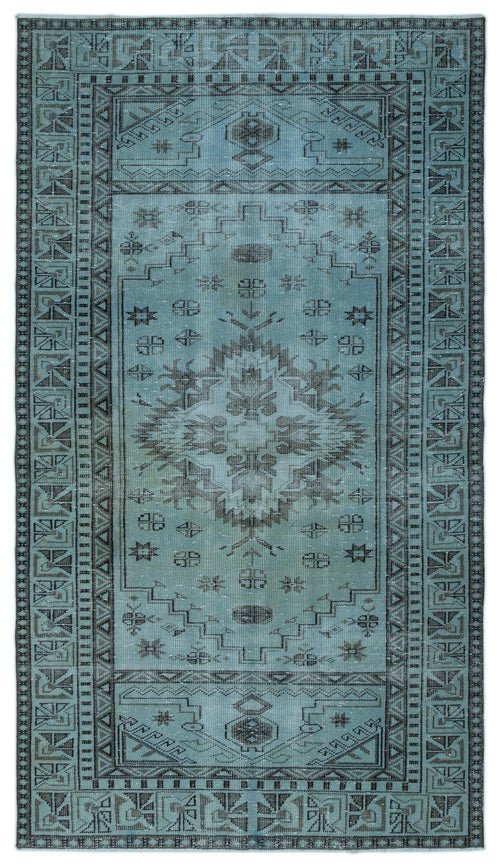 Load image 1 in gallery view. Teal and charcoal distressed rug with a central medallion and geometric border pattern.