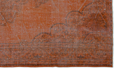 Load image 1 in gallery view. Burnt orange distressed rug with a faded charcoal grey traditional floral medallion pattern.
