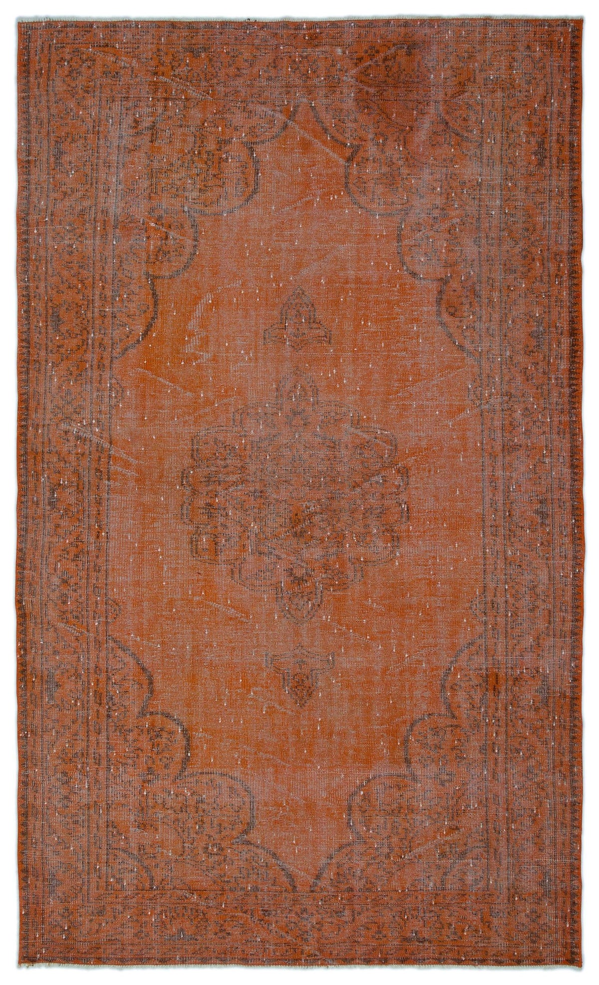 Rust-colored vintage-style rug with a faded charcoal medallion pattern and distressed texture on a white background.