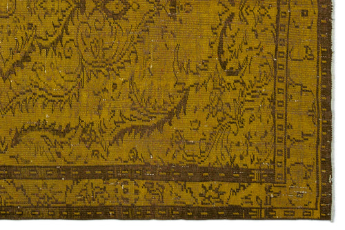 Load image 1 in gallery view. Mustard yellow and brown vintage-style rug with a distressed traditional floral pattern and a geometric border.