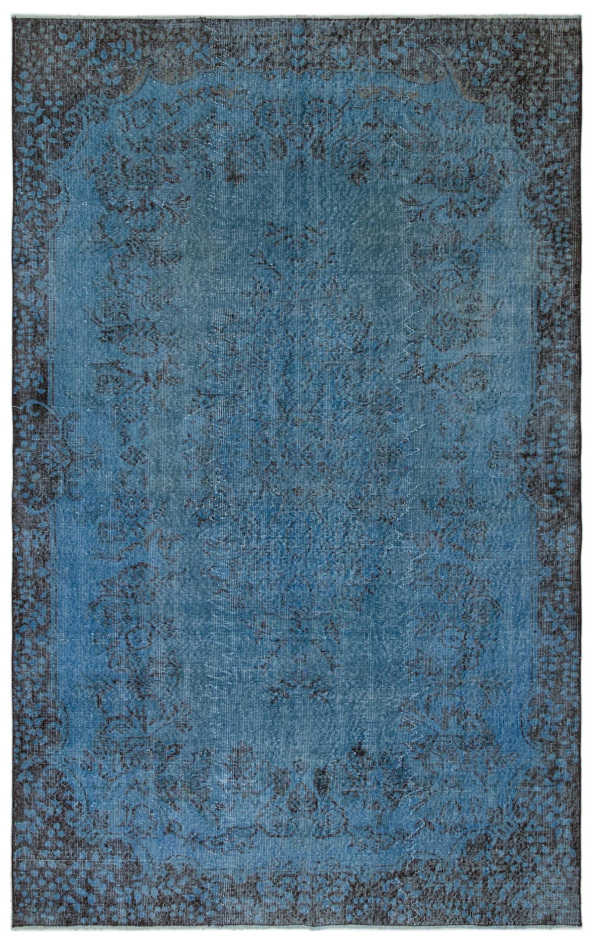 Blue and charcoal distressed traditional rug with a central floral medallion and ornate border.