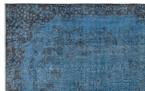 Load image 1 in gallery view. Blue and charcoal distressed rug with a traditional floral medallion pattern.