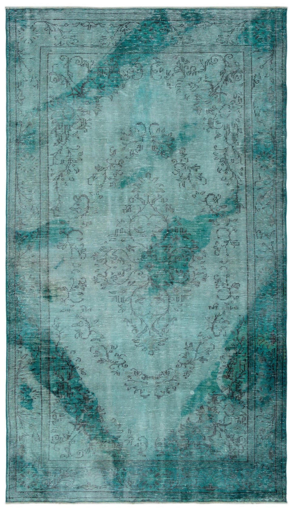 Teal and turquoise distressed rug with a faded central medallion and traditional floral border.