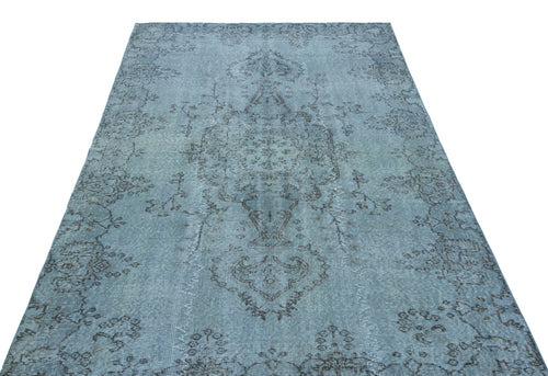 Load image 1 in gallery view. Light blue distressed rug with a dark grey traditional floral medallion pattern.